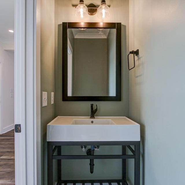 Hallway half bathroom with pocket door