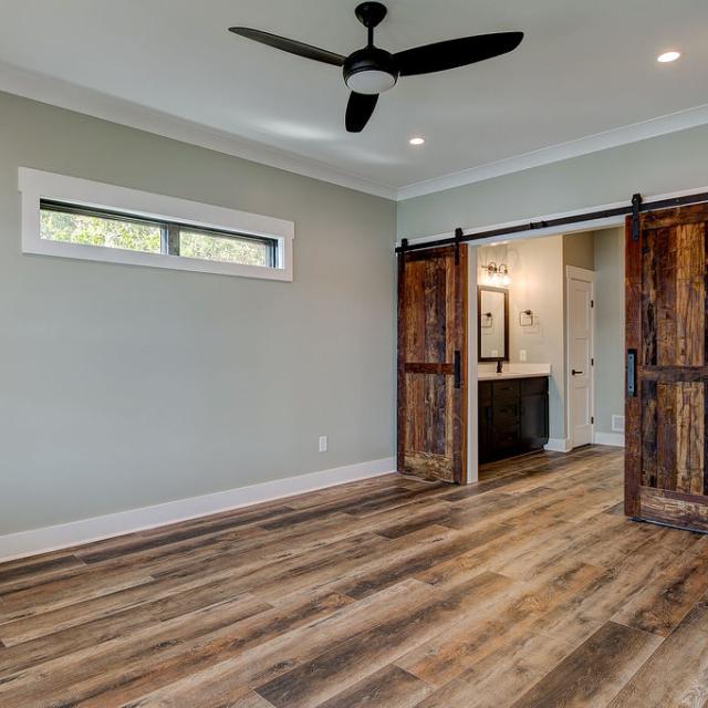 Interior room with wooden floors and rustic farmhouse sliding doors