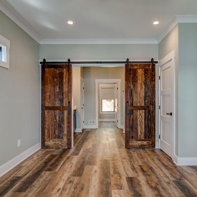 Interior room with wooden floors and rustic farmhouse sliding doors