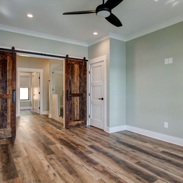 Interior room with wooden floors and rustic farmhouse sliding doors