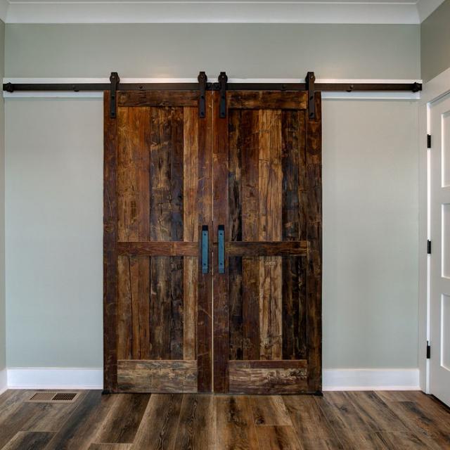 Interior room with wooden floors and rustic farmhouse sliding doors