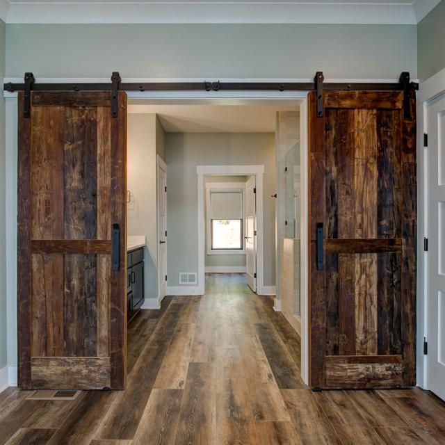 Interior room with wooden floors and rustic farmhouse sliding doors