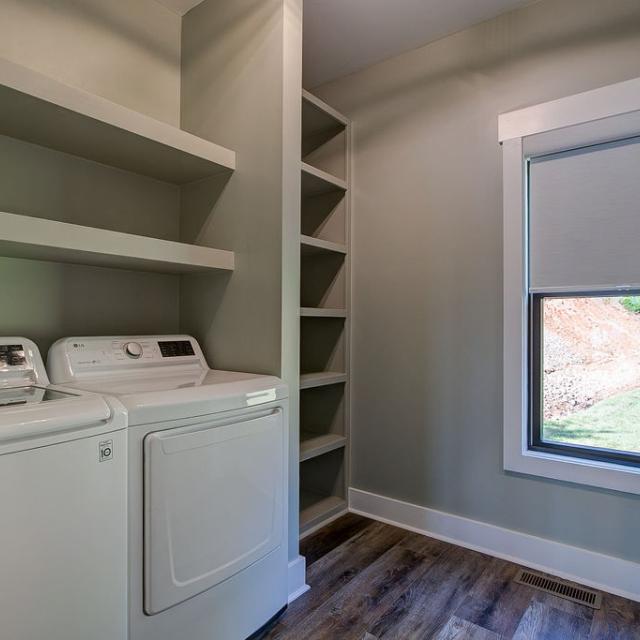 Laundry room with built in shelving