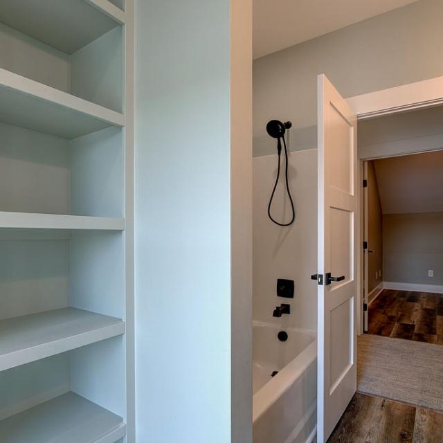 Bathroom with built-in shelving