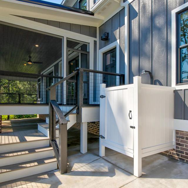 Screened porch of Rafter B custom lakeside home