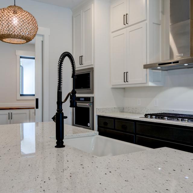 Close up of sink and marble countertops