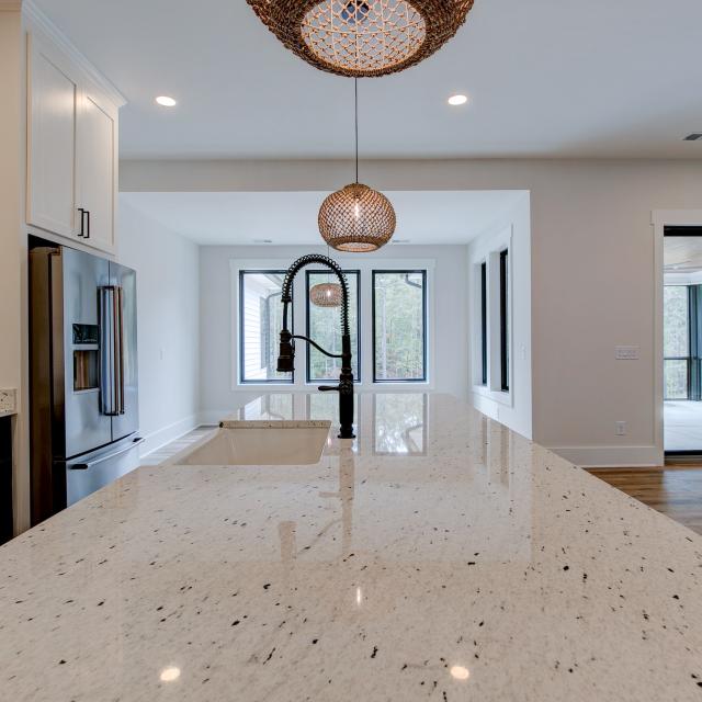 Close up of sink and marble countertops