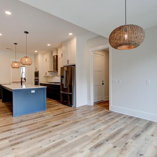 Alternate view of dining room and kitchen