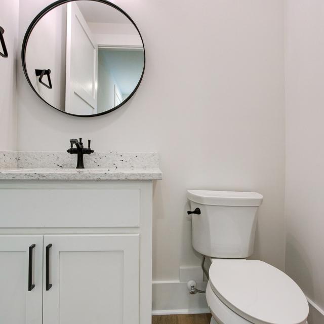 Bathroom with white cabinets