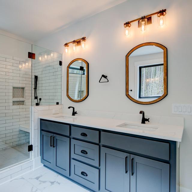 Ensuite bathroom with tub, double sinks and shower