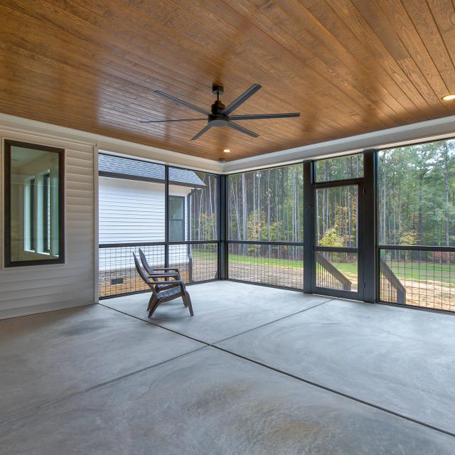 Screened back porch with wood ceiling and ceiling fan